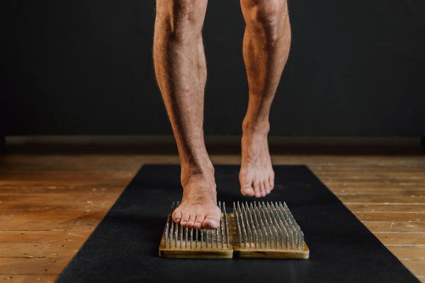 Feet on a yoga mat, suggesting stability and balance.